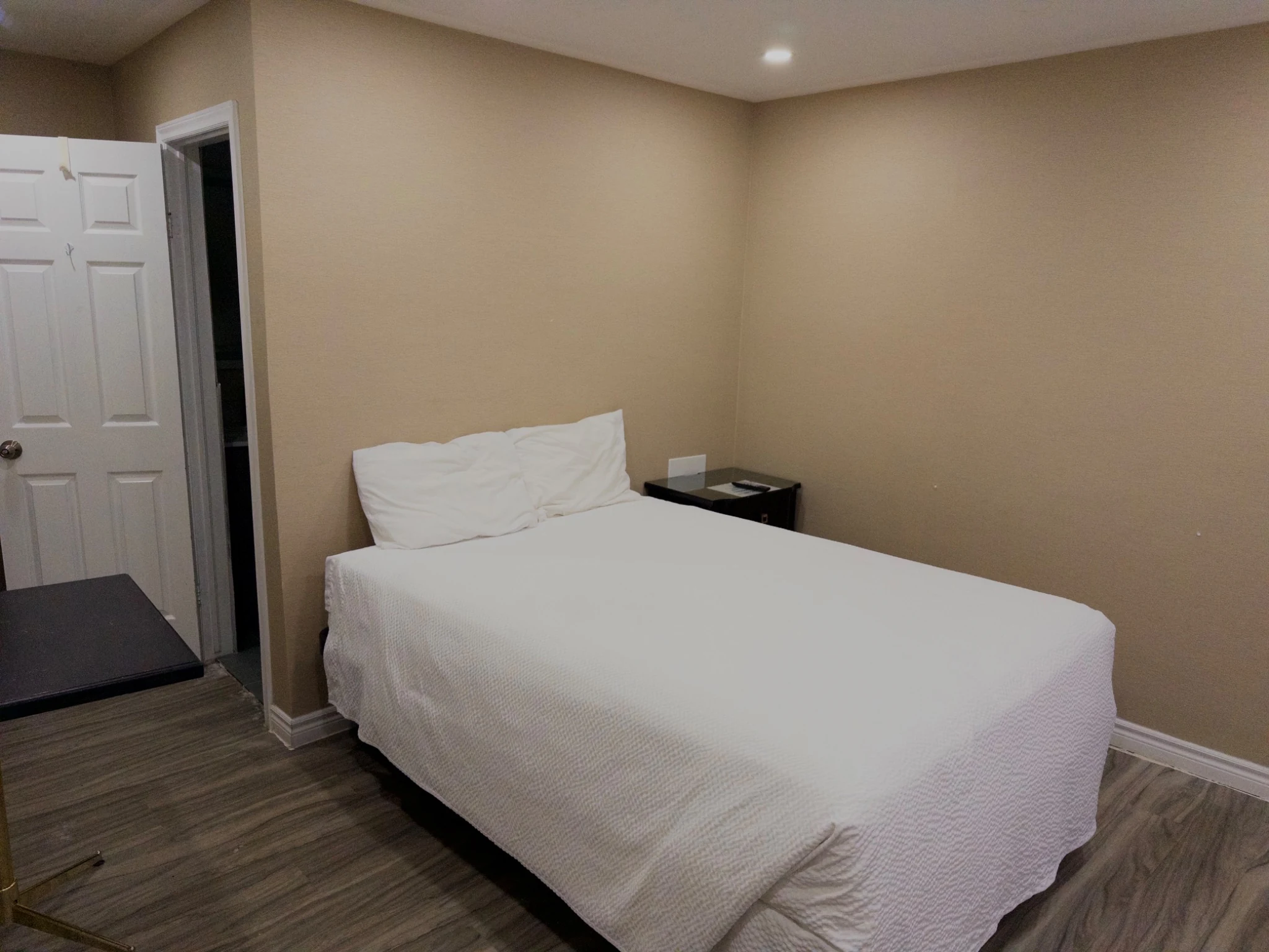 Single Queen Room bed at Wiarton Willys Inn
