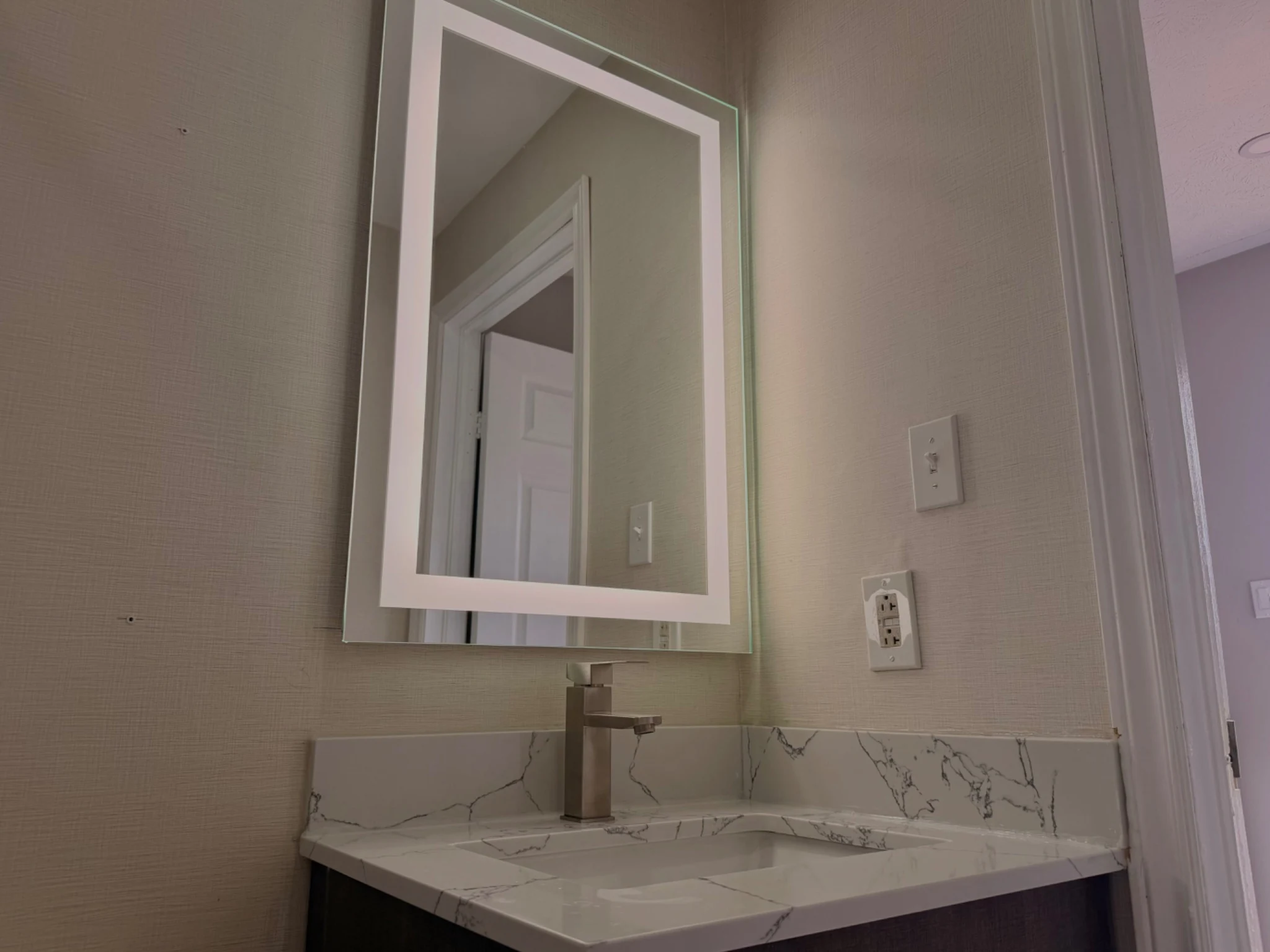 Lighted bathroom mirror inside the Family Room